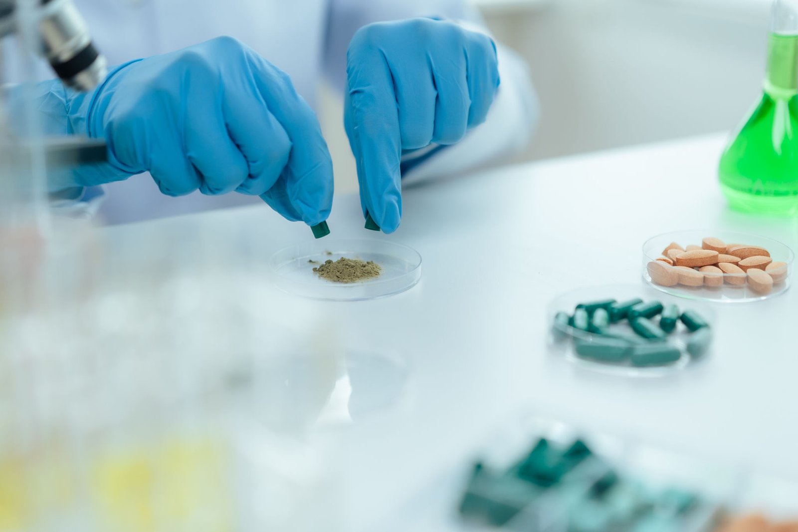 Laboratory technician analyzing botanical capsules to screen for heavy metals in supplements