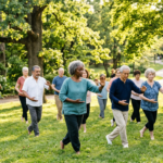 Exercise for Parkinson's May Help Slow Disease Progression A group of seniors does gentle exercise for Parkinson's in an outdoor park setting.